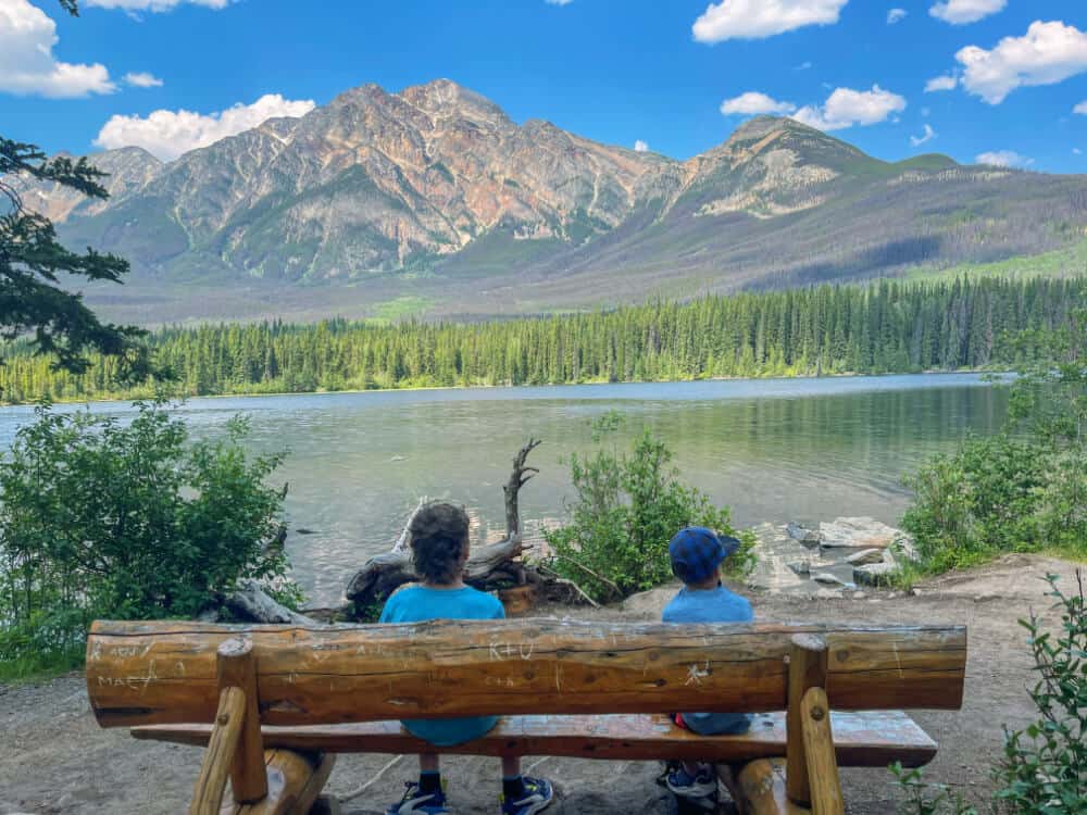 boys sitting on a bench in jasper national pakr