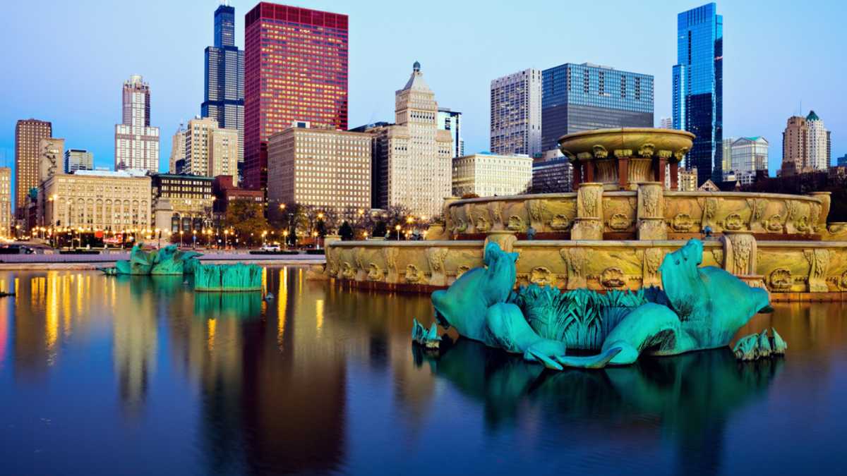 Chicago skyline reflected in Buckingham Fountain. Chicago, Illinois, USA.