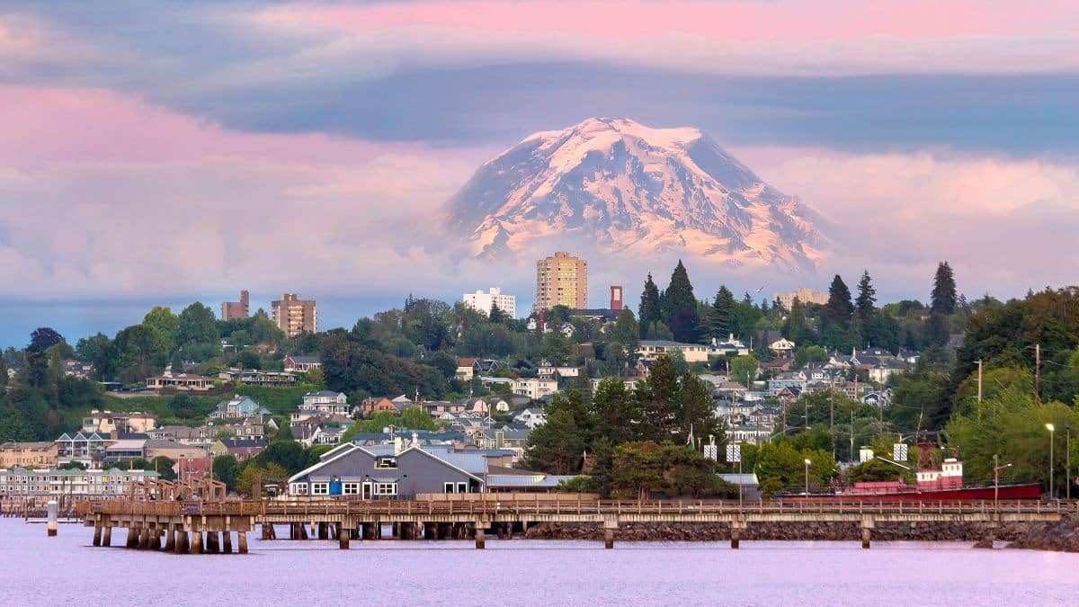 Mount Rainier over Tacoma Washington waterfront during alpenglow sunset evening