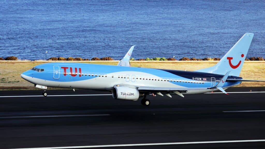 TUI Boeing 737. The Commercial jet aeroplane started the landing gear system for landing.. Airport Funchal, Madeira, Portugal. Atlantic Ocean.