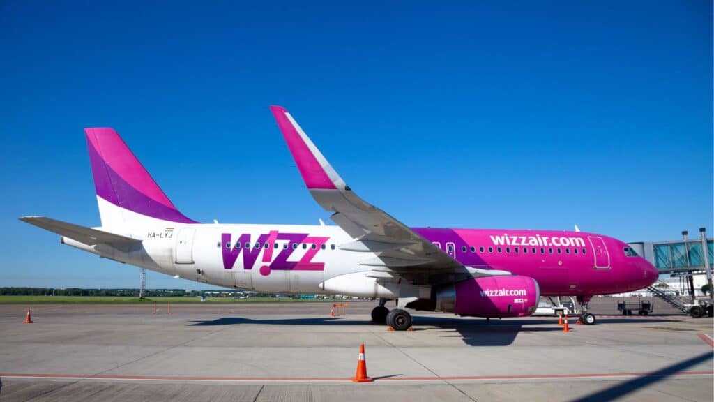 WIZZAIR airline plane at the airport. Airbus A320-232 aircraft - HA-LYJ. Low-cost passenger airplane. Firport apron. Fly on a plane. Trips. Air transport.