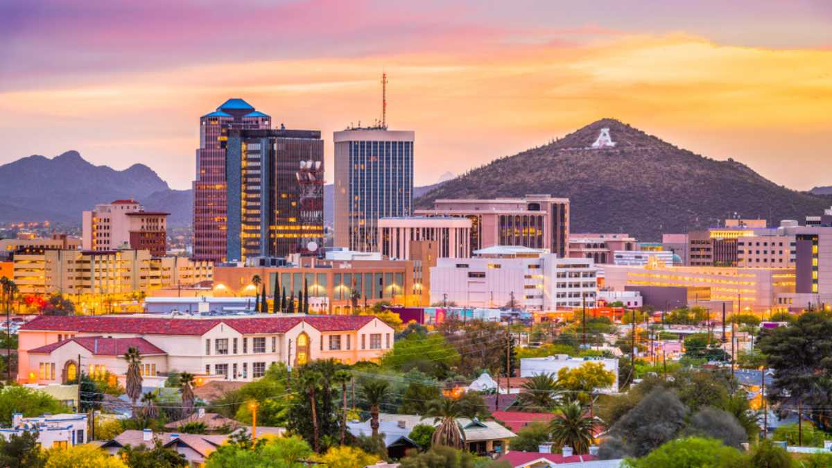 Tucson, Arizona, USA downtown skyline with Sentinel Peak at dusk.