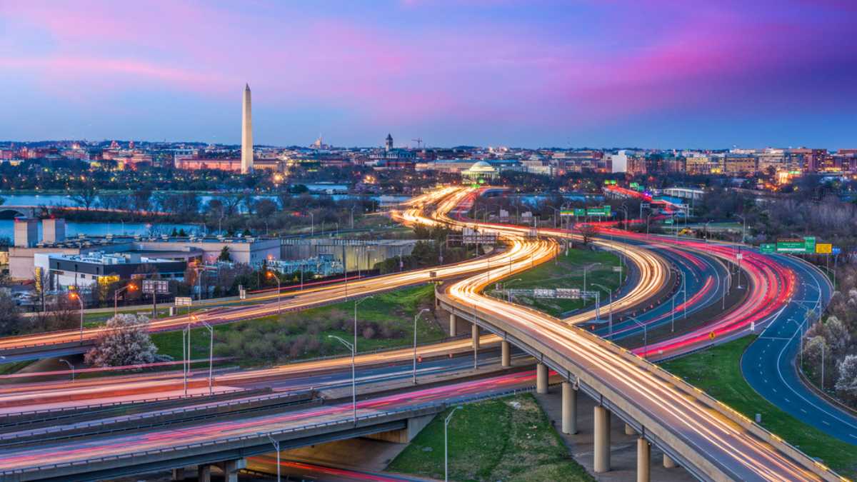 Washington, D.C. skyline with highways and monuments.