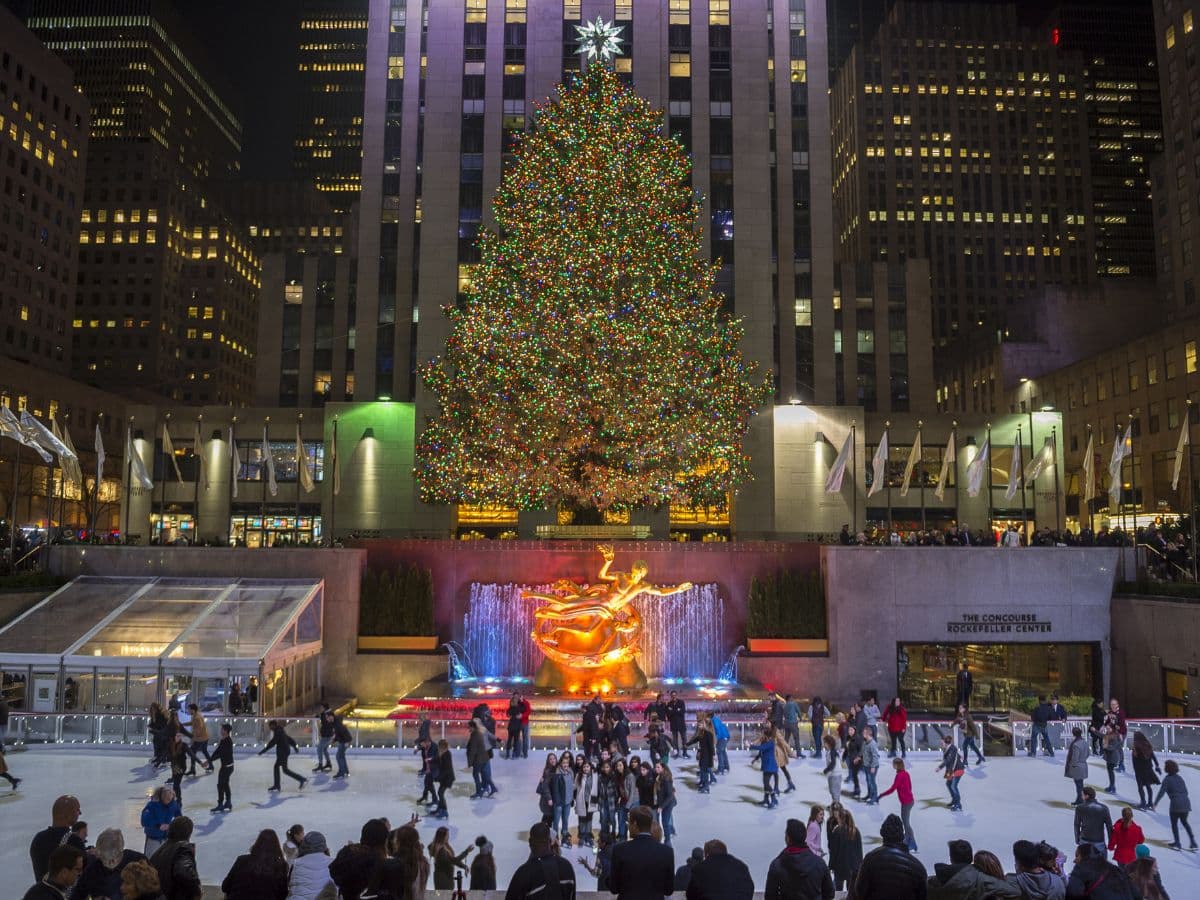 Ice skaters fill the skating rink under the Rockefeller Center Christmas tree, a popular holiday tourist attraction in Midtown Manhattan.