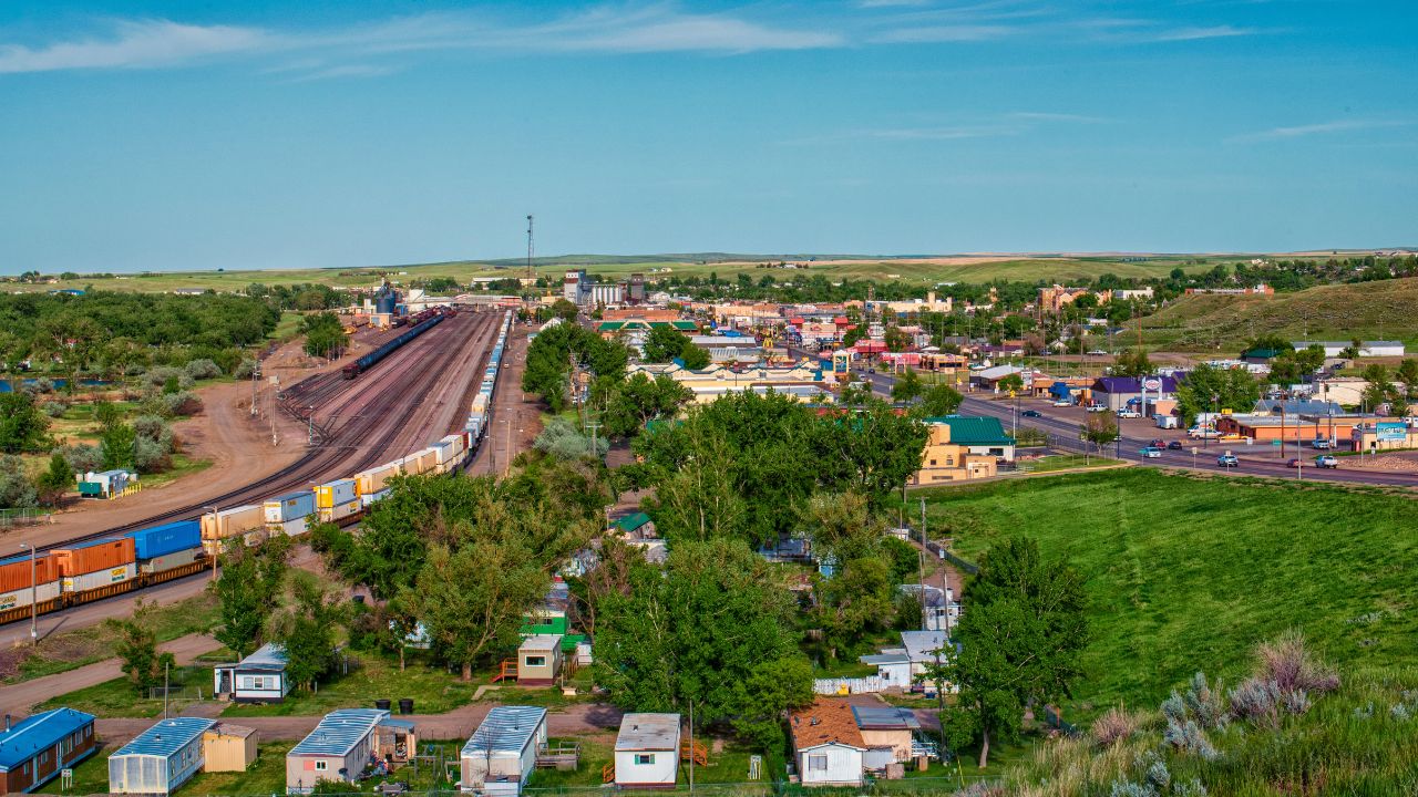 Havre, Montana USA - 6-9-2020: Overlook from US-2 of rail yard switching station and commercial district